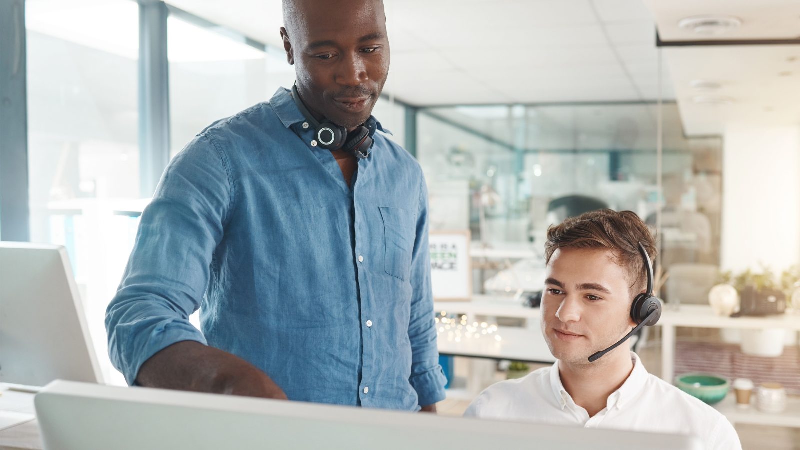 Man learning customer service training for telemarketing call center job, talking about crm and online support skills. Responding to contact us forms, questions and helping give customers good advice